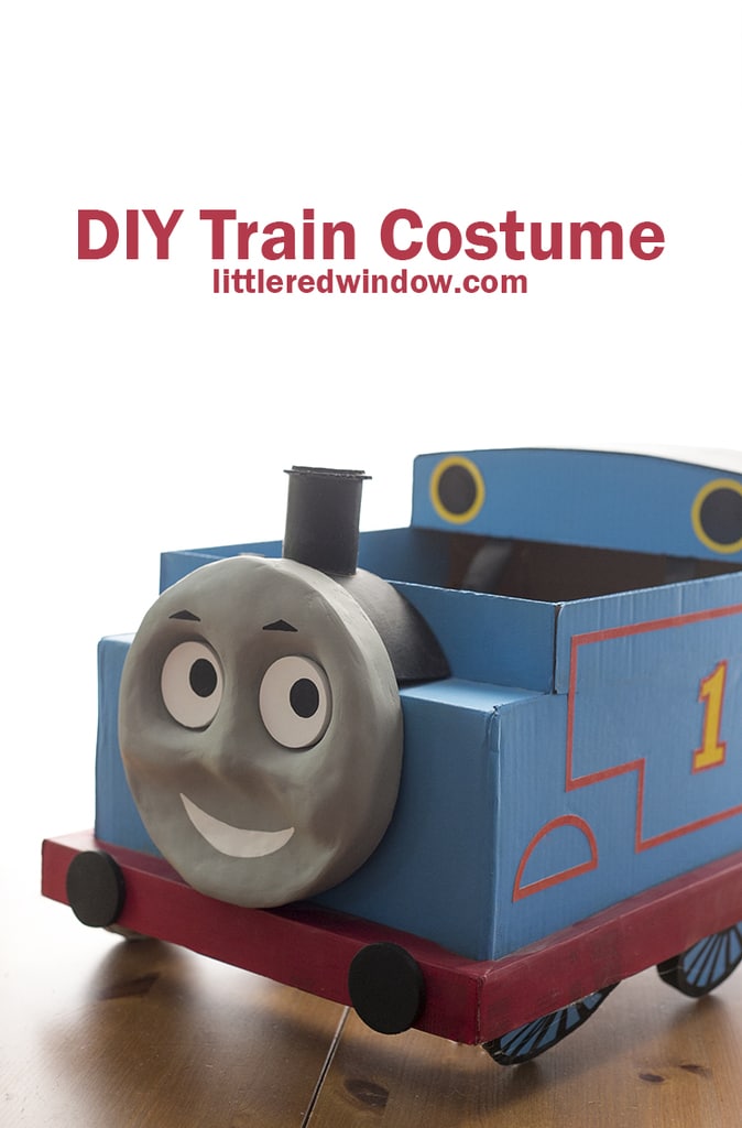 Finished cardboard box Thomas the train costume on the floor!