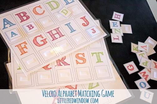 Laminated page showing letters A through J of the alphabet matching game with a pile of letter tiles next to it