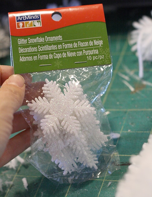 DIY Fluffy Snowflake Pom Pom Wreath, make a soft fluffy and easy snowflake wreath from pom poms! via littleredwindow.com