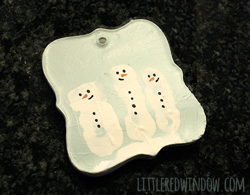 handpainted carrot noses added to the white snowman fingerprint shapes