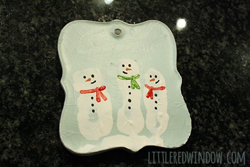 handpainted red and green scarves added to the white snowman fingerprint shapes
