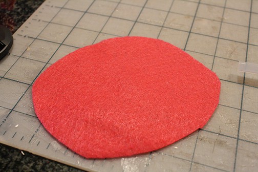 pink felt circle on a gray cutting mat