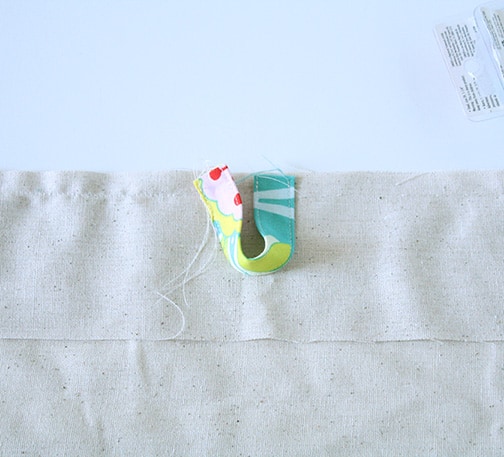 Travel Drawstring Laundry Bag Tutorial | littleredwindow.com | Make an pretty and useful travel laundry bag with cute stenciled detail with this great tutorial!