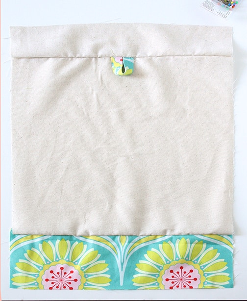 Travel Drawstring Laundry Bag Tutorial | littleredwindow.com | Make an pretty and useful travel laundry bag with cute stenciled detail with this great tutorial!