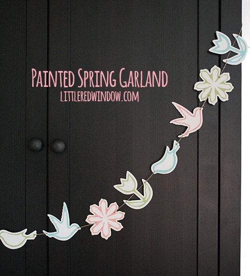 Finished spring garland hanging on a black cabinet
