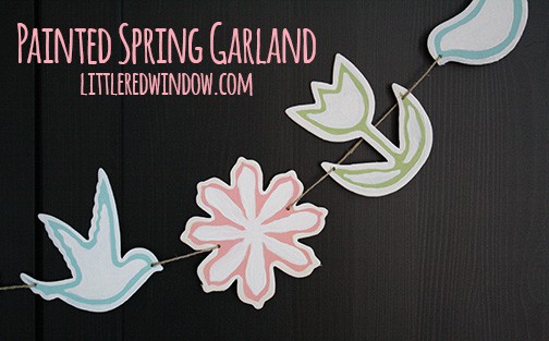 Finished spring garland hanging on a black cabinet