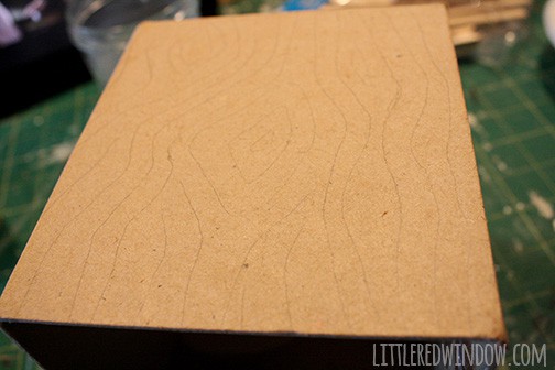 Tissue box cover with wood grain pattern drawn in pencil