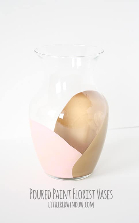 clear glass vase with pink and gold abstract paint inside