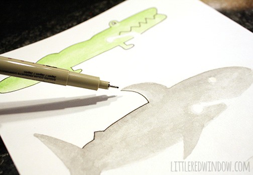 pen adding details to animal shapes