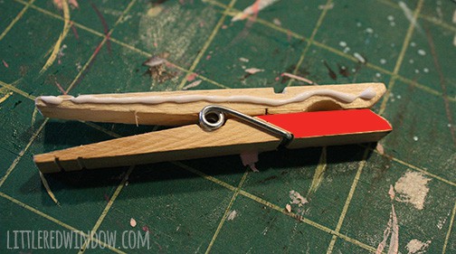 clothespin with red indicating where jaw goes