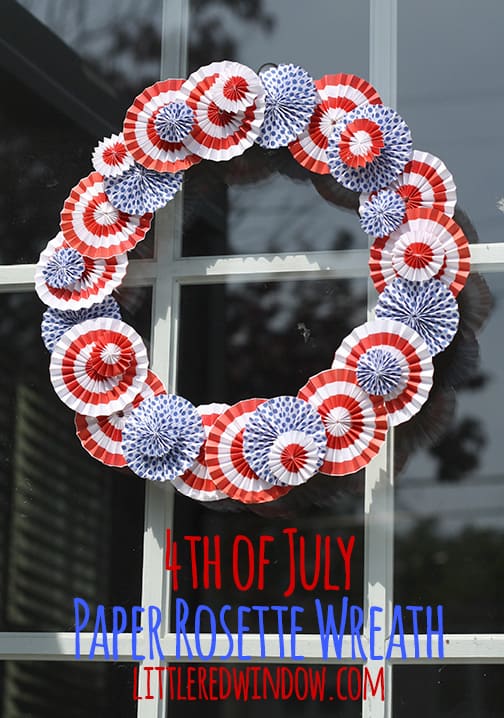 Red and white rosette wreath on a window