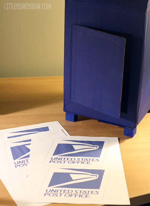 Mailbox next to logos printed on paper