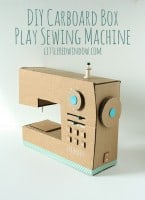 DIY Cardboard Box Play Sewing Machine in front of a white background