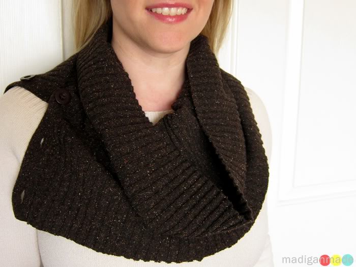 Smiling woman wearing brown knit button up cowl