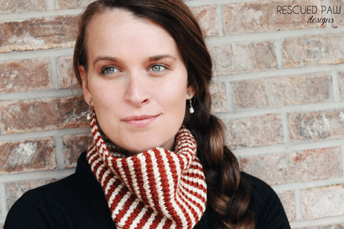 Woman wearing red and white striped knit cowl