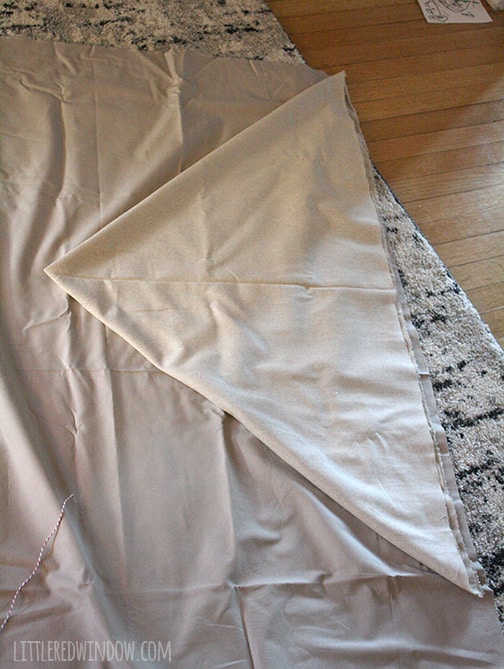 two layers of fabric laid out on floor