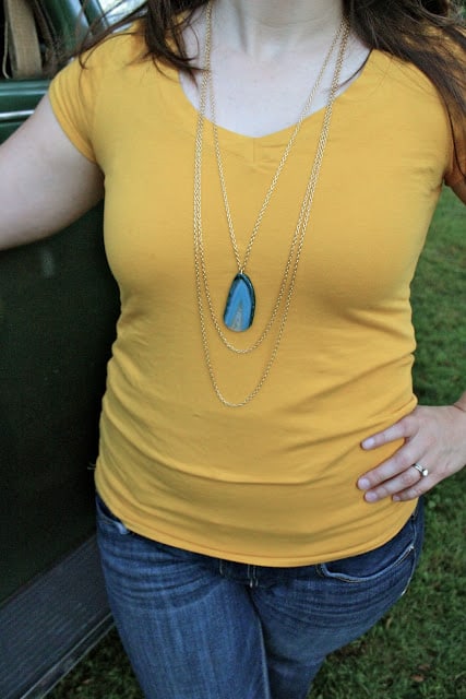 woman wearing agate slice necklace