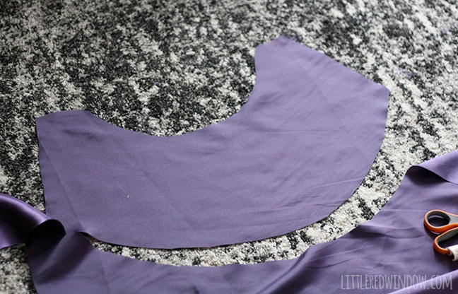 purple fabric with cape shape cut out