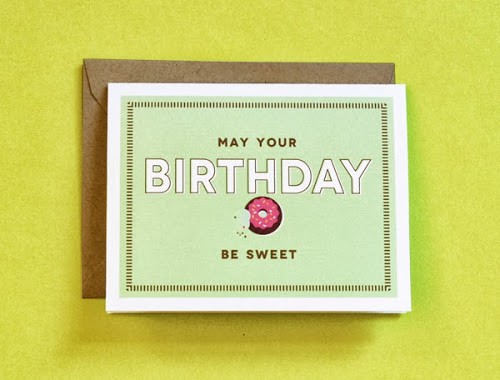 green card that says MAY YOUR BIRTHDAY BE SWEET with a donut