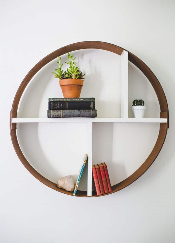 round wood shelf with white dividers