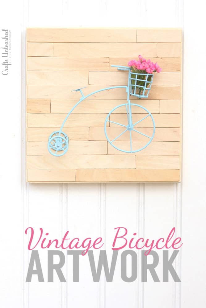 blue vintage bicycle wire art on wood background