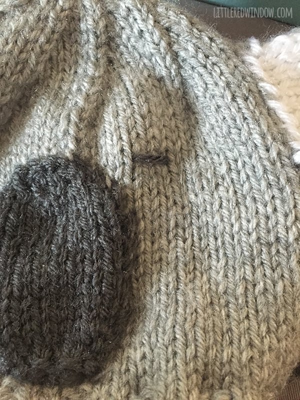 closeup of how to embroider the koala eye on the front of the koala hat 