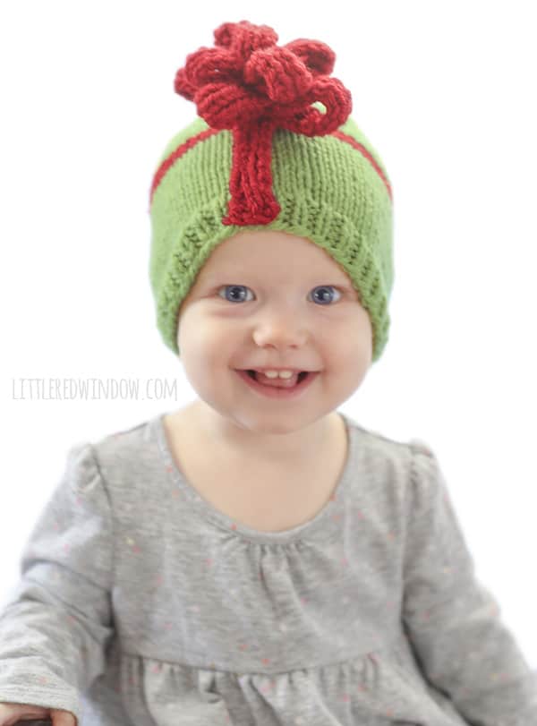 Wrap up your sweetest gift with this adorable Christmas Present Bow Hat Knitting Pattern for newborns, babies and toddlers! | littleredwindow.com