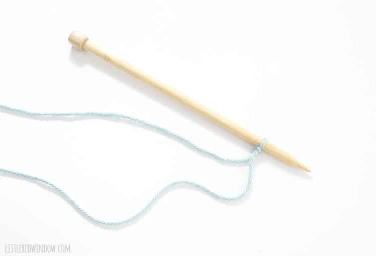 Pull to tighten the slip knot on your knitting needle and begin your cast on.