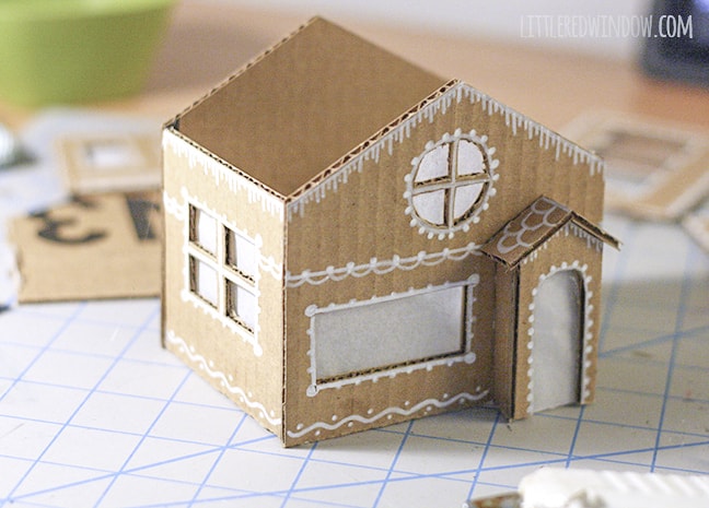 Tiny Cardboard Gingerbread Houses | littleredwindow.com | Make these adorable little Gingerbread Houses out of cardboard, they even light up!