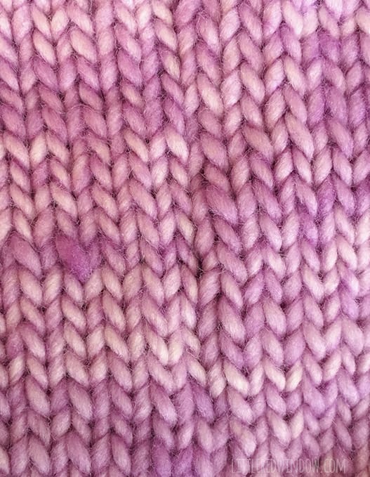 Closeup view of the invisible seam on the knit flat baby hat knitting pattern