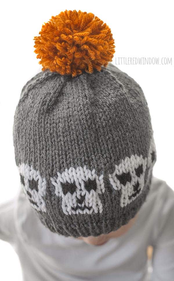 Spooky Skull Hat Knitting Pattern with instructions for all sizes from newborn to baby to toddler! This cute hat is a quick and easy knit and perfect for Halloween!