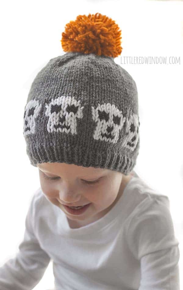 Spooky Skull Hat Knitting Pattern with instructions for all sizes from newborn to baby to toddler! This cute hat is a quick and easy knit and perfect for Halloween!