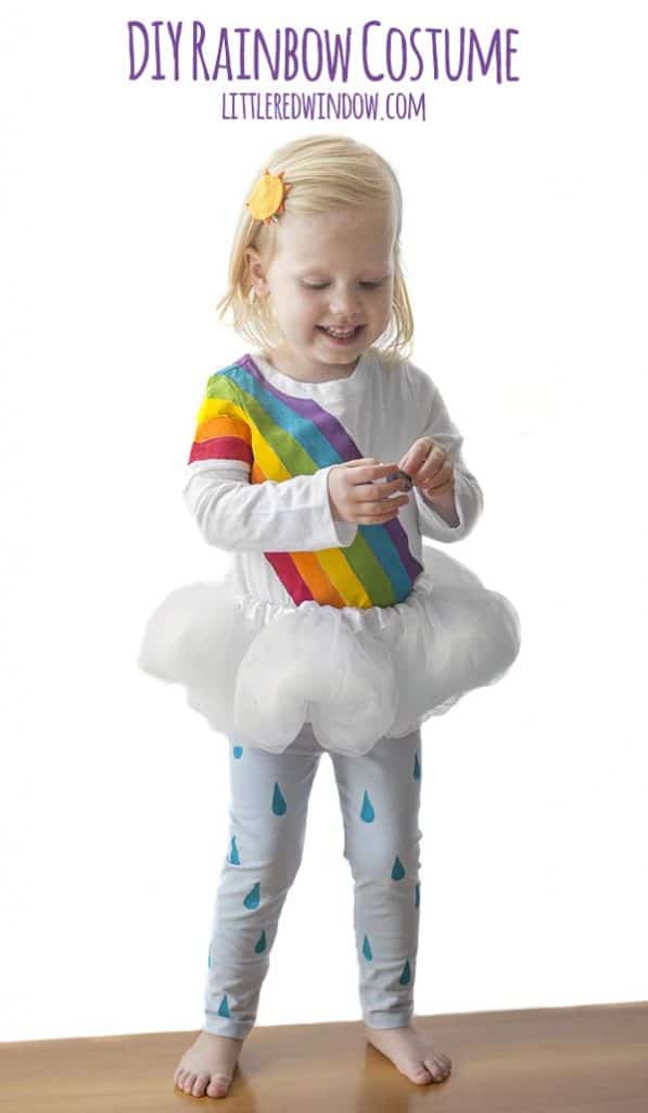 DIY Rainbow Costume for Kids! Get instructions to make this adorable costume including rainbow shirt, cloud tutu, raindrop leggins and sun hair clip!