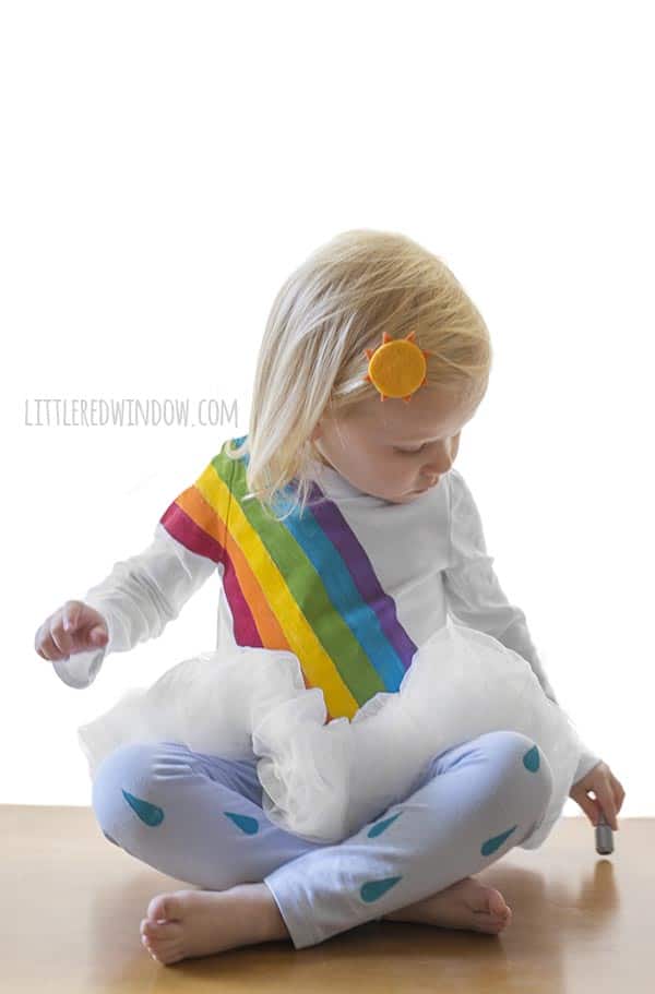 DIY Rainbow Costume for Kids! Get instructions to make this adorable costume including rainbow shirt, cloud tutu, raindrop leggins and sun hair clip!