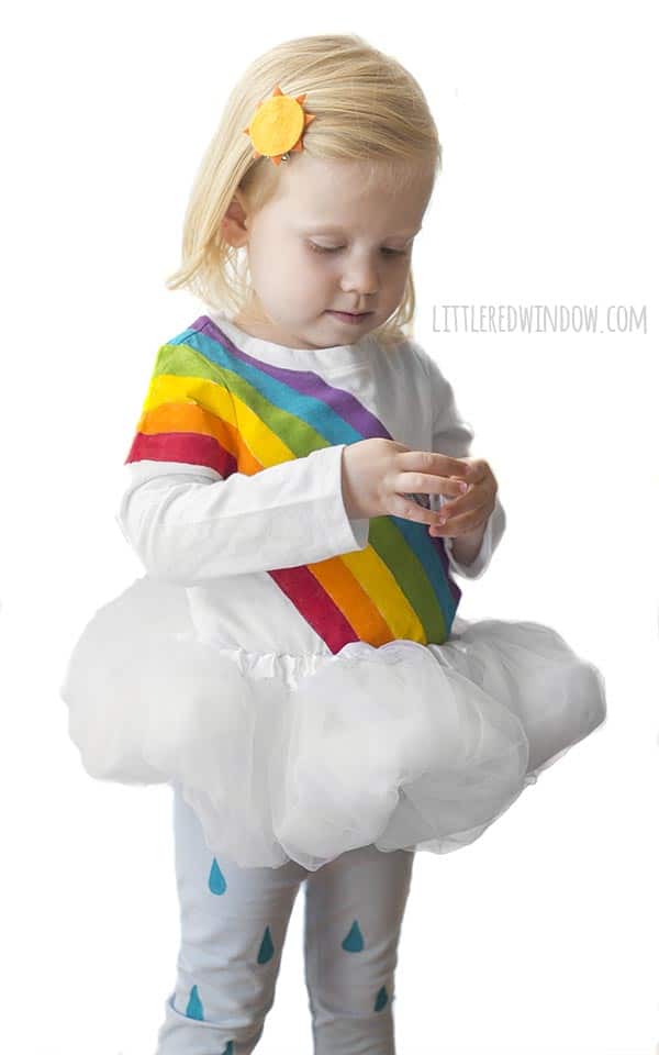 DIY Rainbow Costume for Kids! Get instructions to make this adorable costume including rainbow shirt, cloud tutu, raindrop leggins and sun hair clip!
