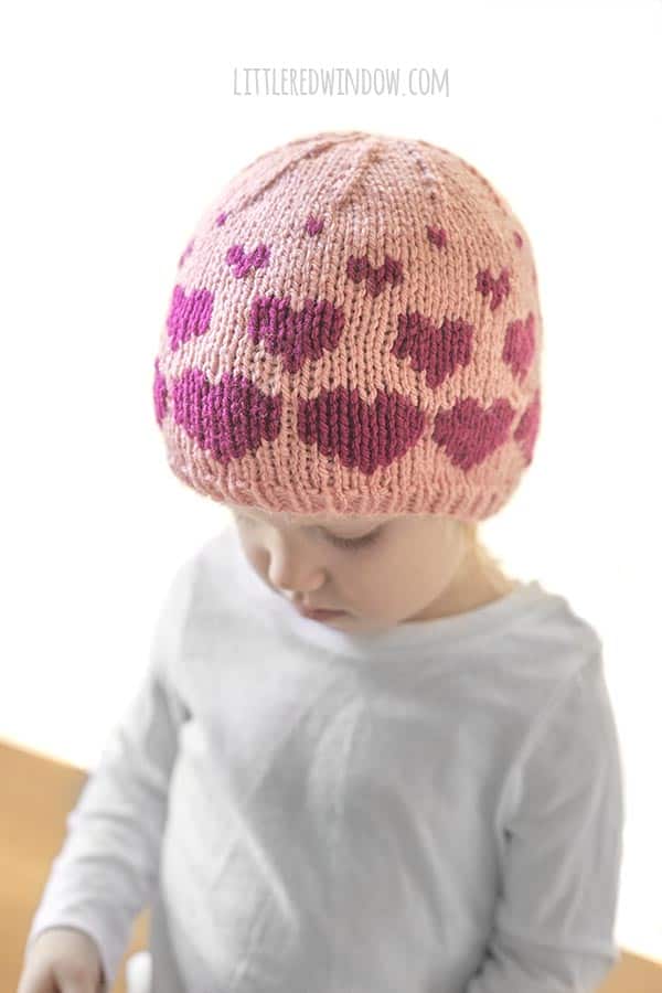 Cute baby wearing Valentine Floating Hearts Hat knitting pattern!