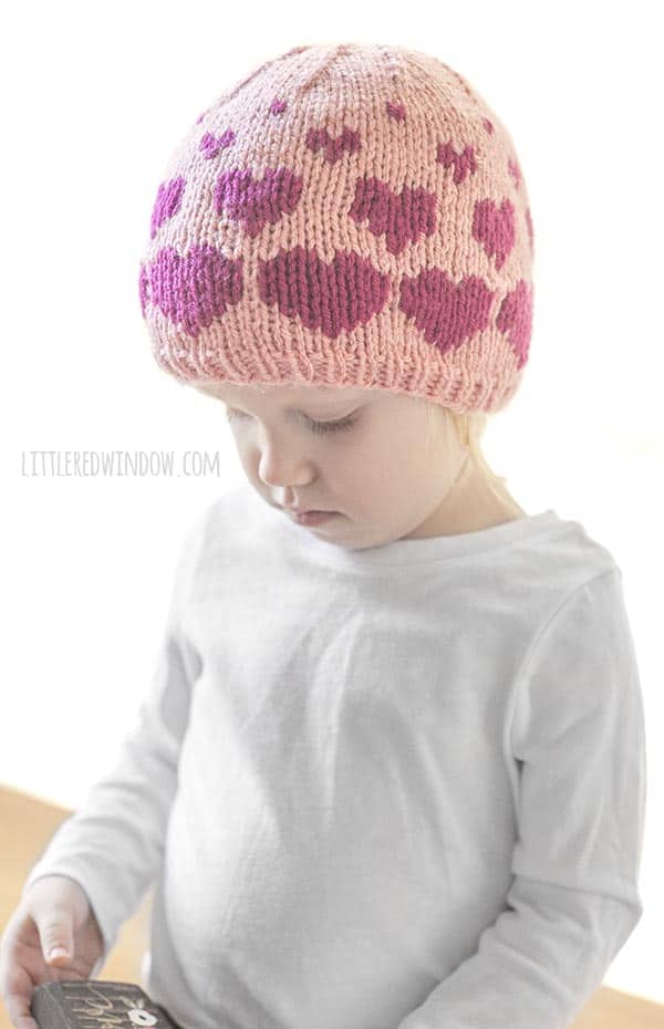 Cute baby wearing Valenting Floating Hearts Hat knitting pattern!