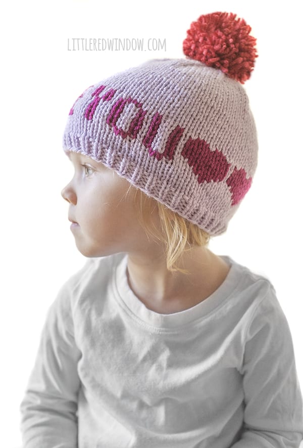 Cute baby wearing Valentine Love Notes Hat knitting pattern! 