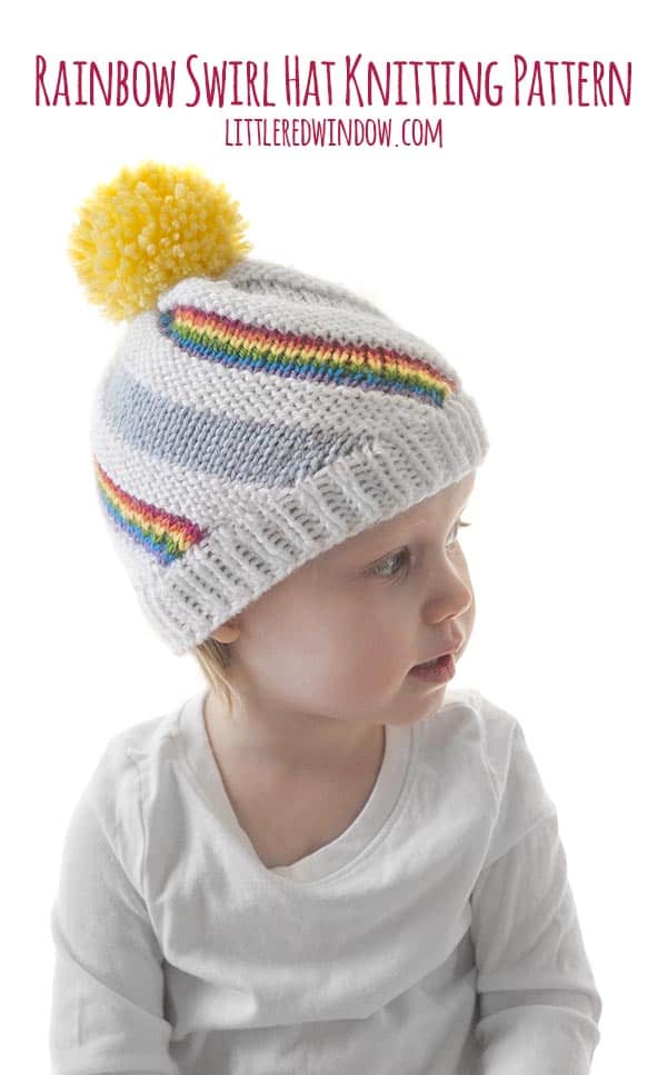 The Rainbow Swirl Hat knitting pattern has alternating swirling stripes of blue sky, white clouds and colorful rainbows!