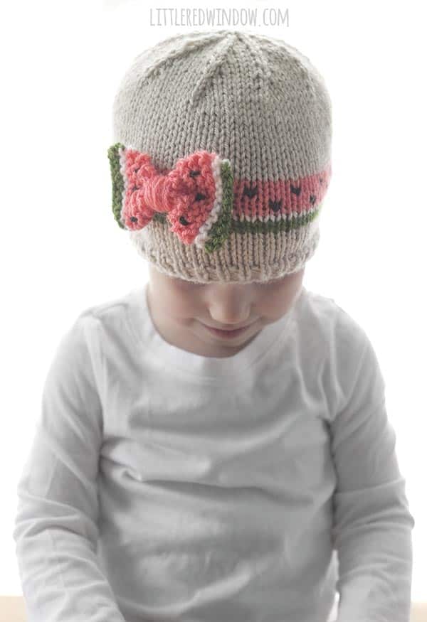 The Watermelon Bow Hat knitting pattern is the perfect easy baby hat pattern for summer babies & toddlers!