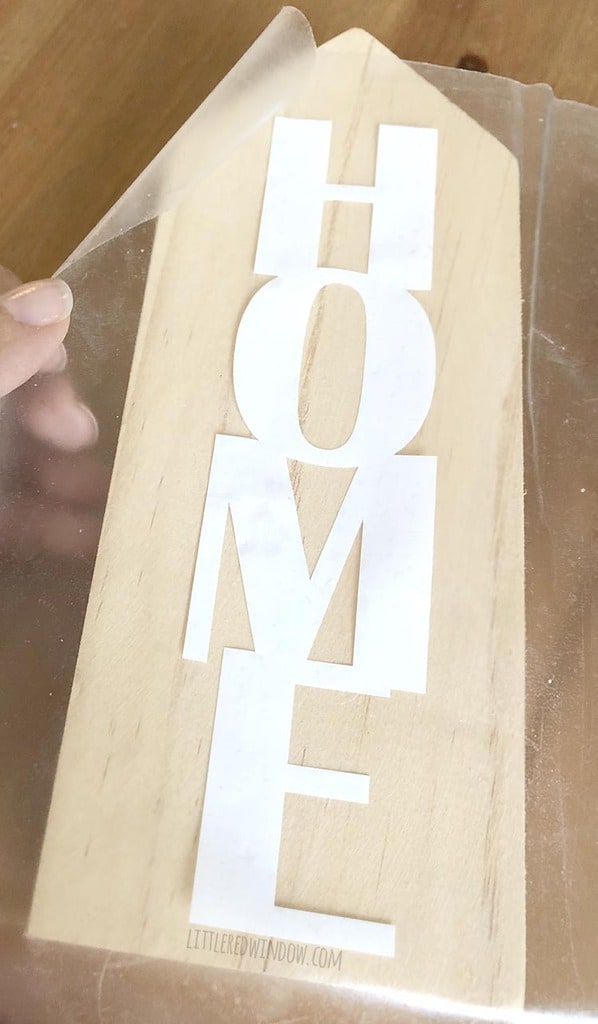 Position the home sweet home decor vinyl onto the wooden block