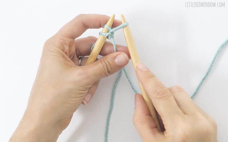 For a cable cast on, pull the working yarn through between the two stitches on the left needle