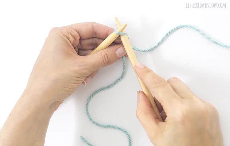 Start a knitted cast on by inserting the right needle just like you would for a knit stitch