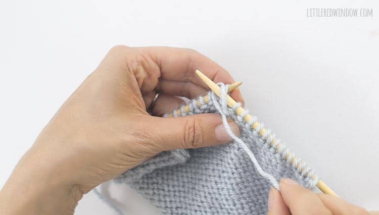 Wrap the yarn around the right needle to form a purl stitch