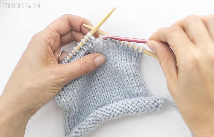 Pull the horizontal yarn through the live stitch