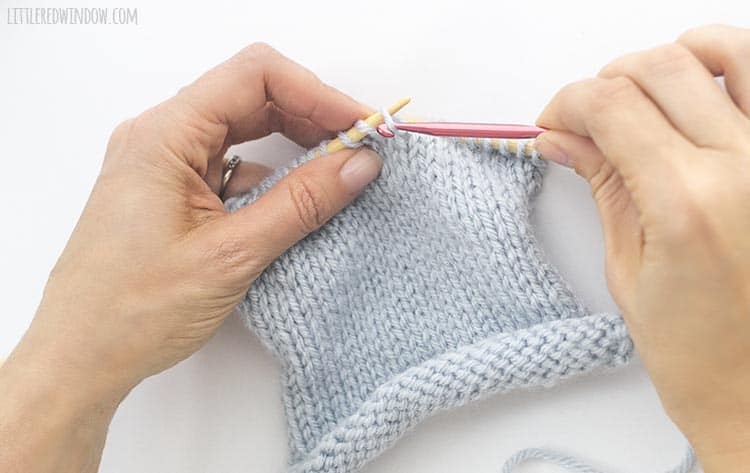 Put the dropped knit stitch back onto the left knitting needle