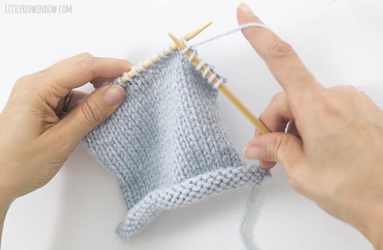 Pull the knit stitch through