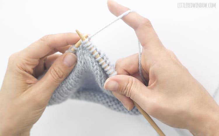 To finish a kfb stitch, pull the yarn through again to increase by a second stitch, then drop the original stitch from the left knitting needle
