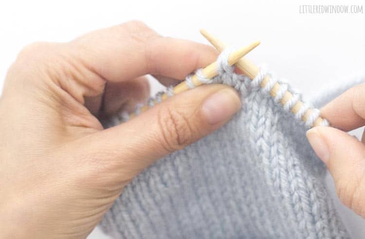 Insert the right needle through the back of the first two stitches on the left knitting needle