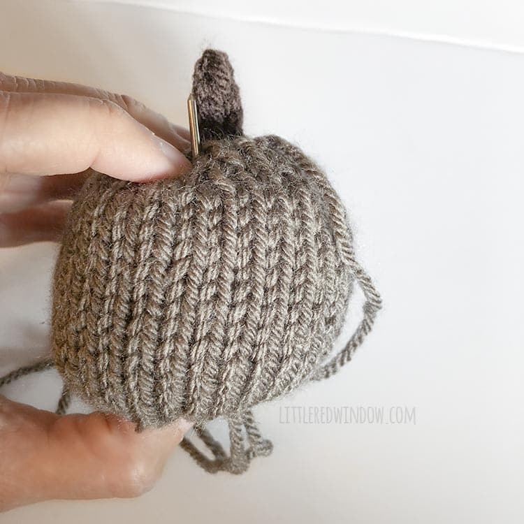 Use the yarn needle to shape your adorable knit little pumpkins!